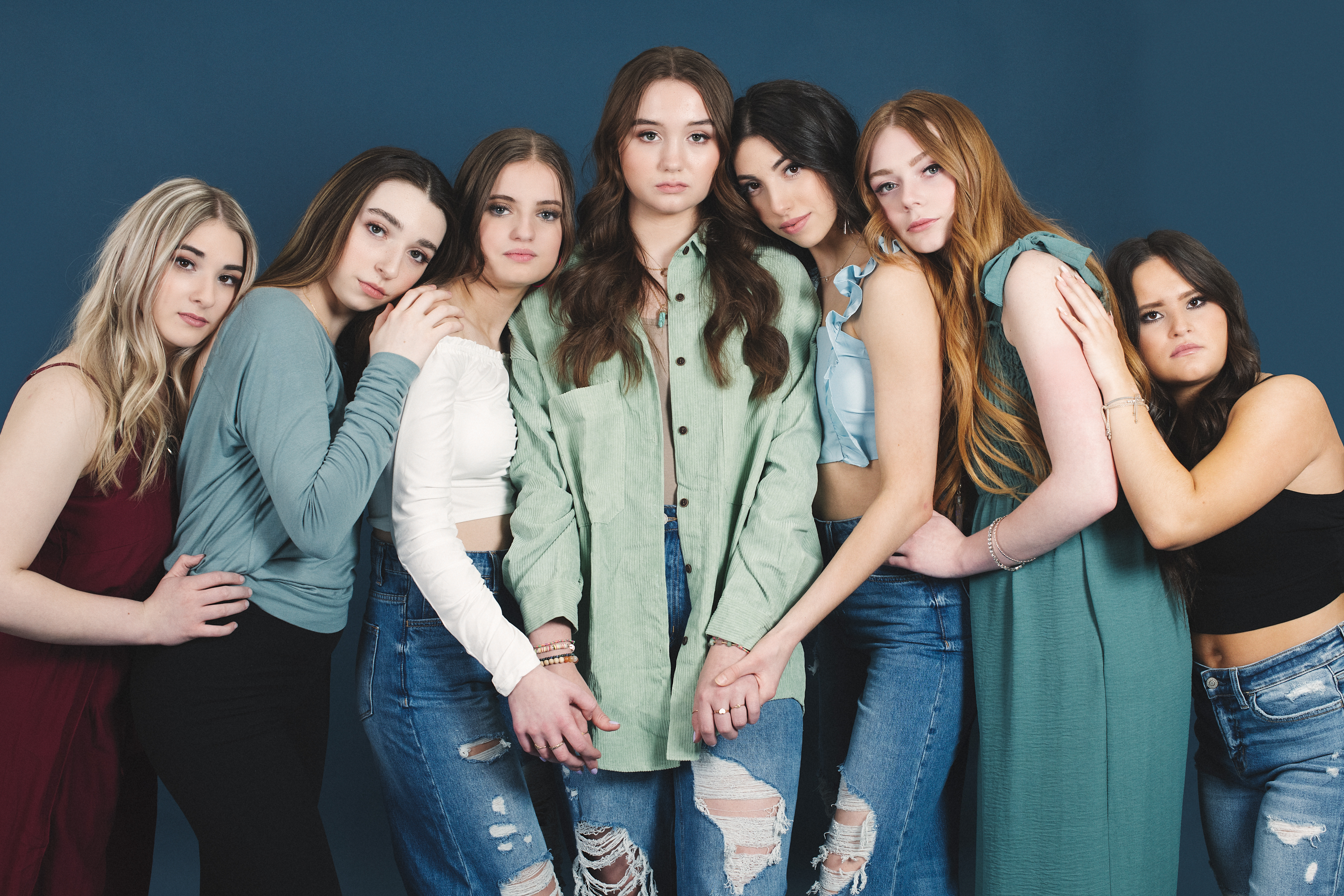 Group of seven high school senior girls during a studio branded styled shoot.